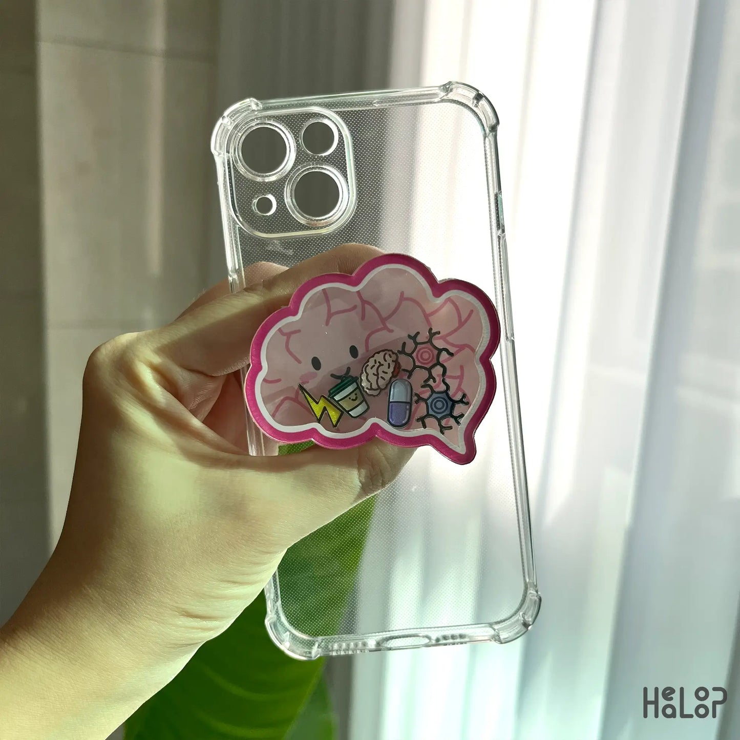 Brain-shaped shaker phone grip on transparent phone case