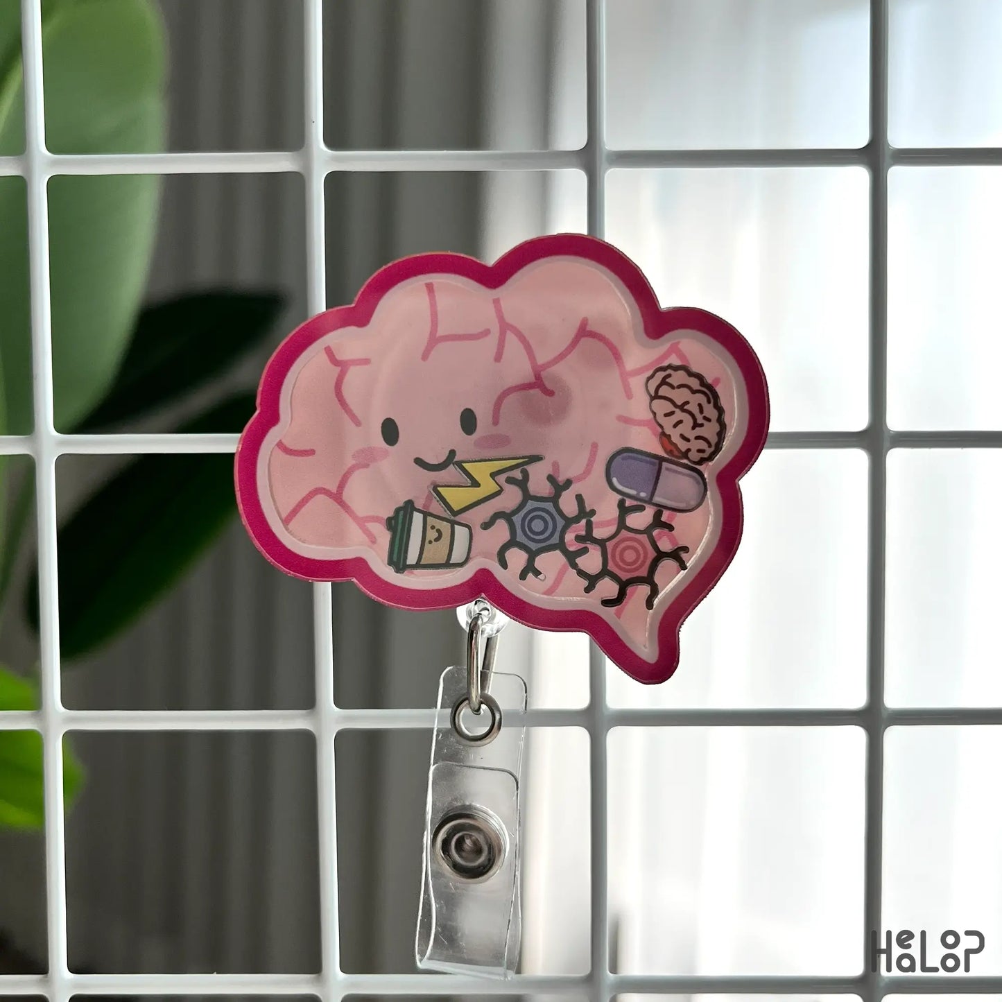 Grid view of shaker badge reel with mini brain and sparkle charms