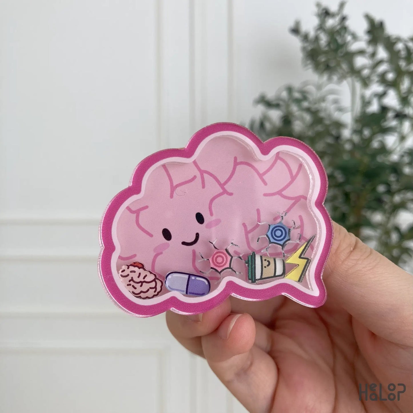 Cute anatomical brain shaker phone grip with floating charms, handheld