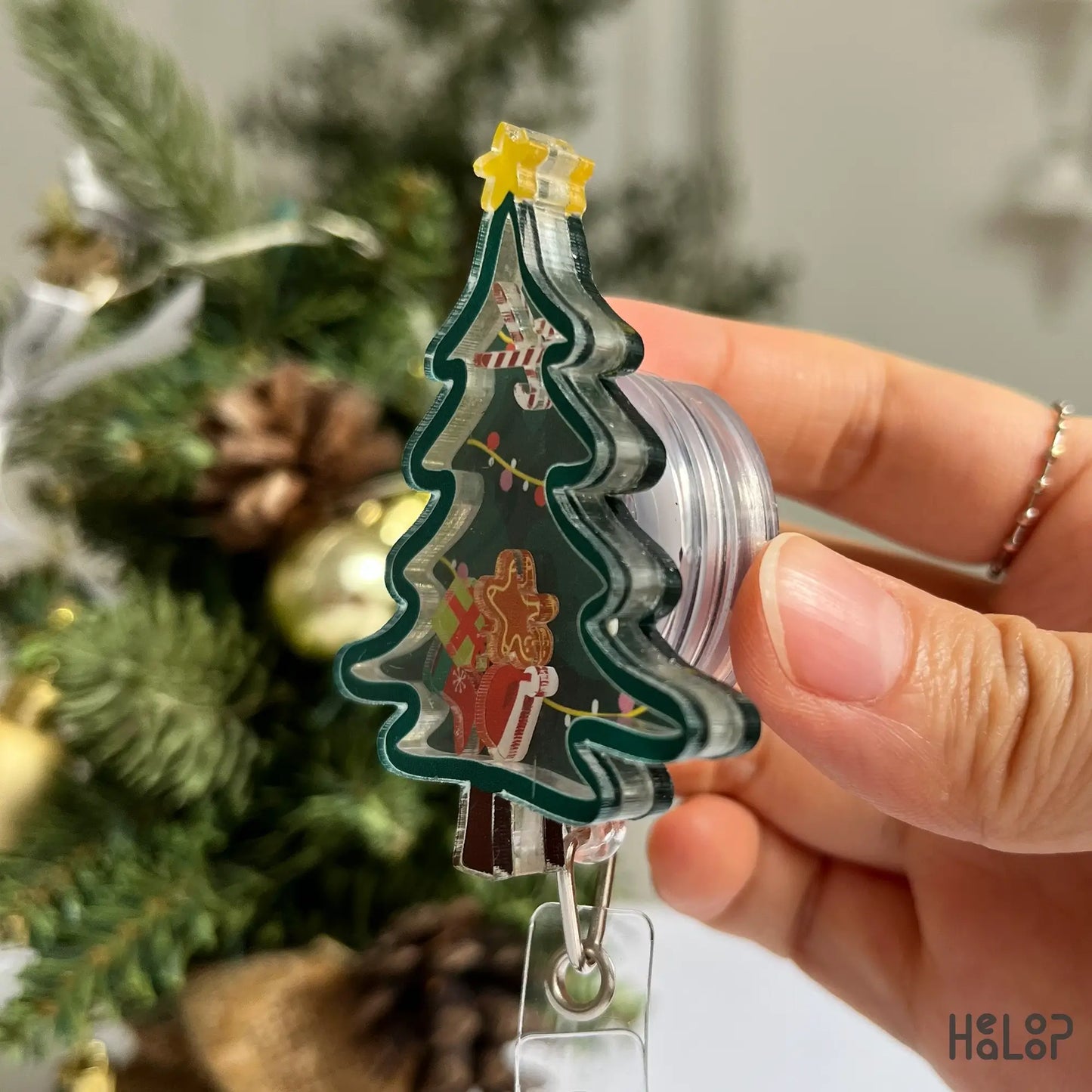 Funny and cute Christmas badge reel with gingerbread cookie, present, and stocking charms