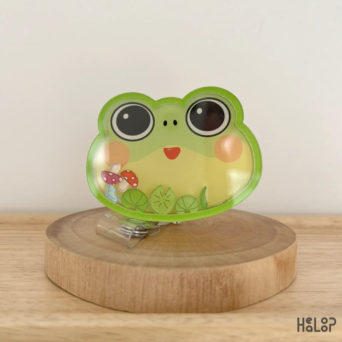 Frog shaker badge reel front design with cute frog face