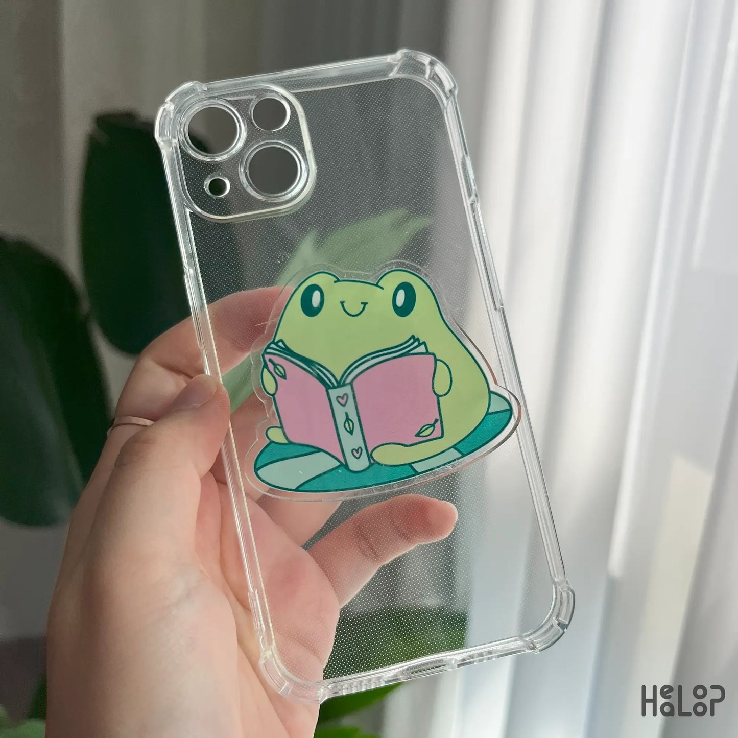 Frog Bookish phone grip on transparent phone case