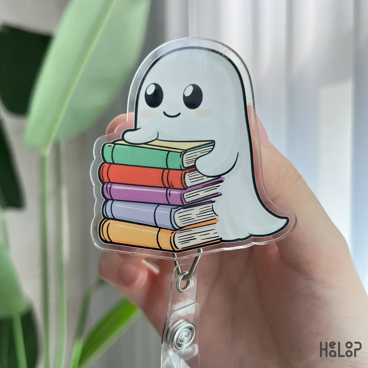 Ghost holding stack of colorful books retractable acrylic badge reel