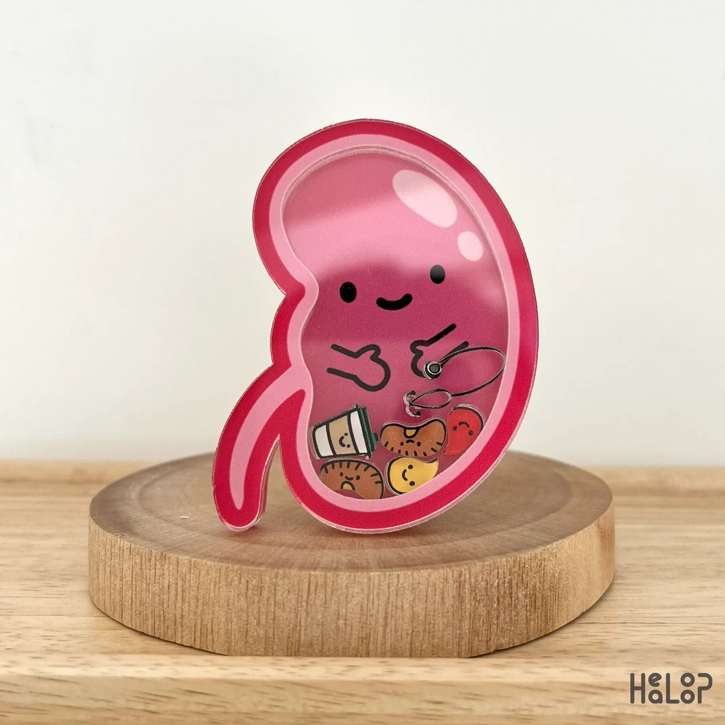 Front view of kidney-shaped shaker badge reel with pee and kidney charms