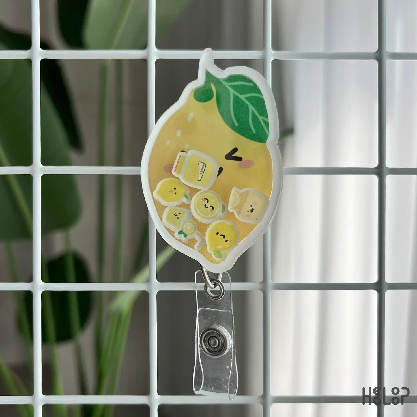 lemon shaker badge reel with smiling lemon face and mini charms, perfect for nurse accessories