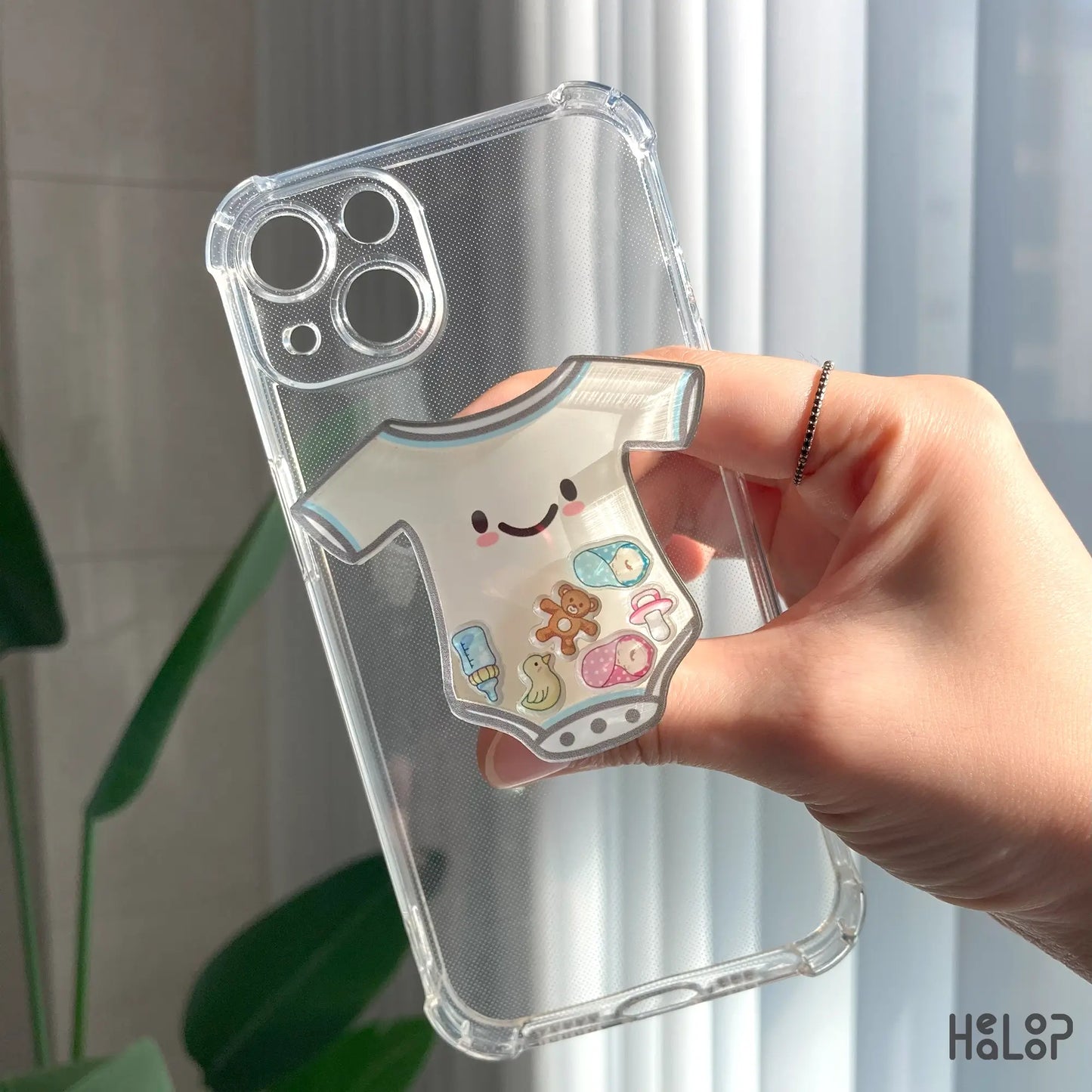 NICU shaker phone grip mounted on clear phone case, durable acrylic phone holder