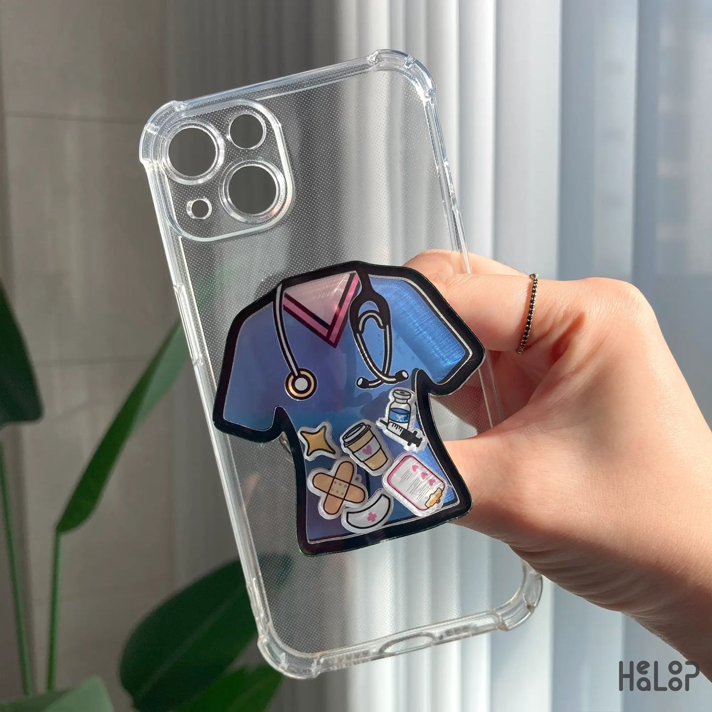 Acrylic nurse shaker phone grip attached to a transparent phone case, cute nurse gift accessory