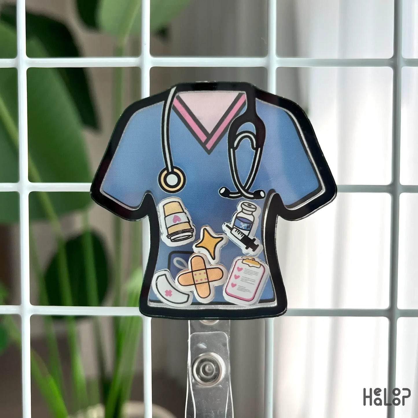 Front view of blue scrub-top nurse shaker badge reel with stethoscope and retractable ID clip.