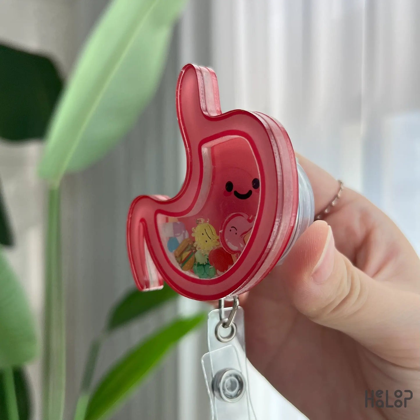 Side angle of acrylic stomach shaker badge reel, fun nurse ID holder and medical gift