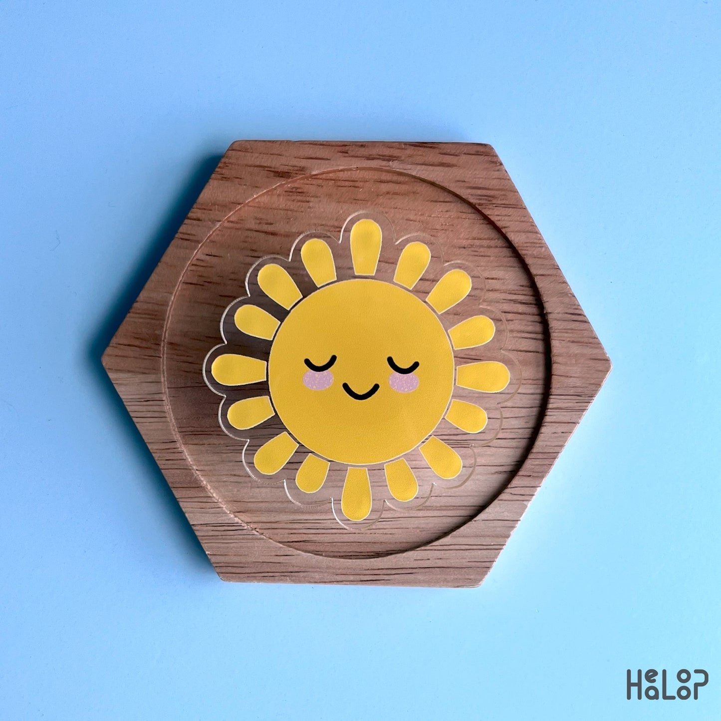 Sunshine phone grip displayed on wood, durable acrylic adhesive grip and phone stand