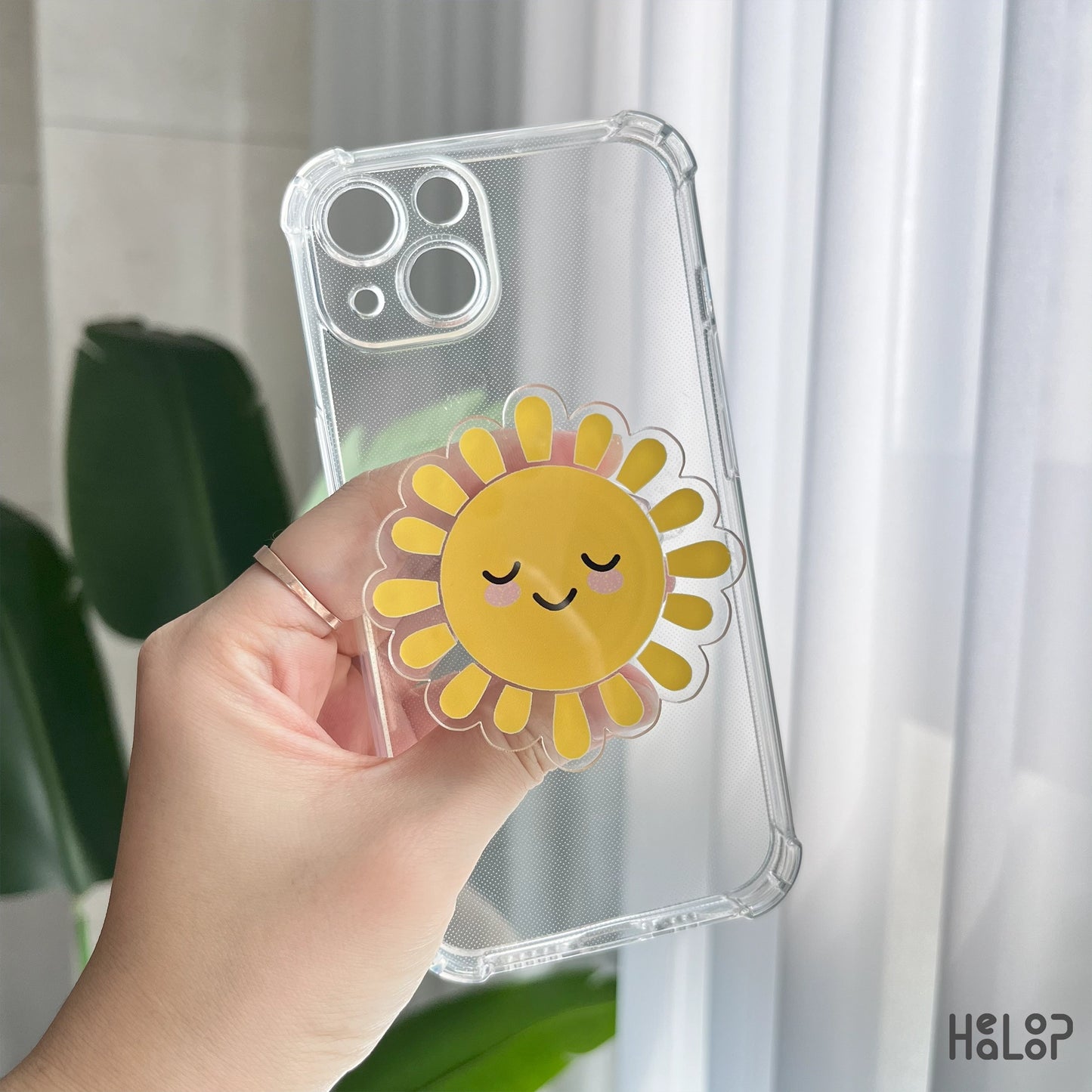 Sunshine acrylic phone grip on transparent case, perfect for smartphones and Kindle devices