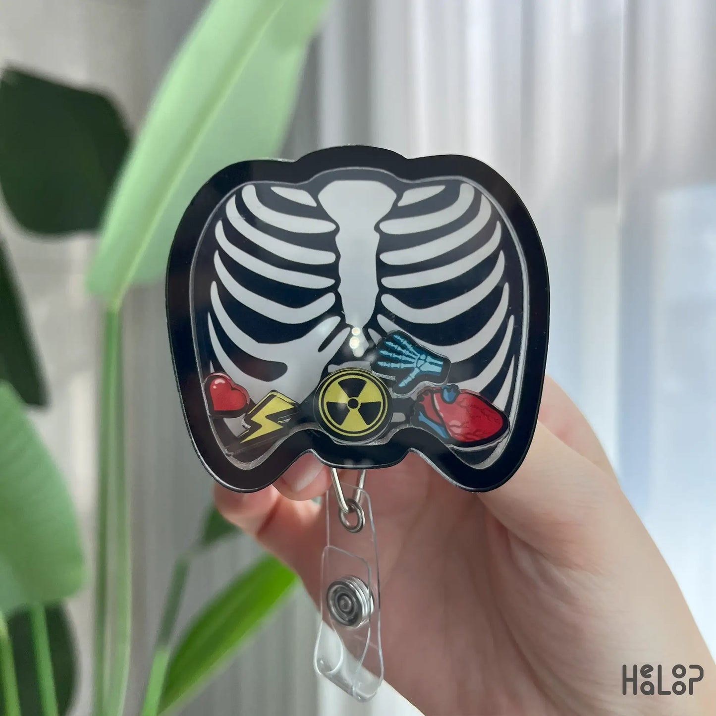 Radiology tech retractable badge reel with skeleton ribcage design and shaker heart charms