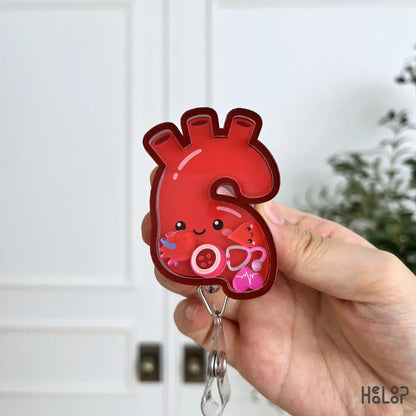 Cute anatomical aorta shaker badge reel with moving cardiology charms for nurses, healthcare workers, and medical professionals.