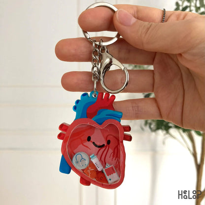 Anatomical heart shaker keychain with medical charms
