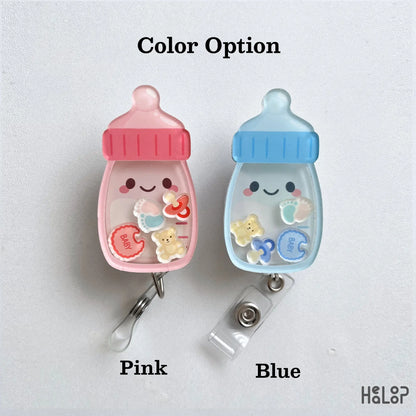 Baby Bottle Shaker Badge Reel available in pink and blue with cute moving baby themed charms