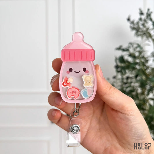 Baby bottle shaker badge reel with baby themed charms and acrylic badge holder