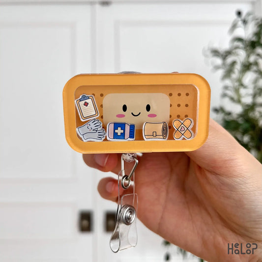 Front close-up of cute bandage shaker badge reel with nurse-themed charms