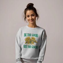 Model styled in Be The Good See The Good heater grey sweatshirt – vintage sunflower aesthetic crewneck.