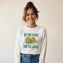 Model wearing Be The Good See The Good sunflower sweatshirt in white – soft and comfortable motivational sweater.