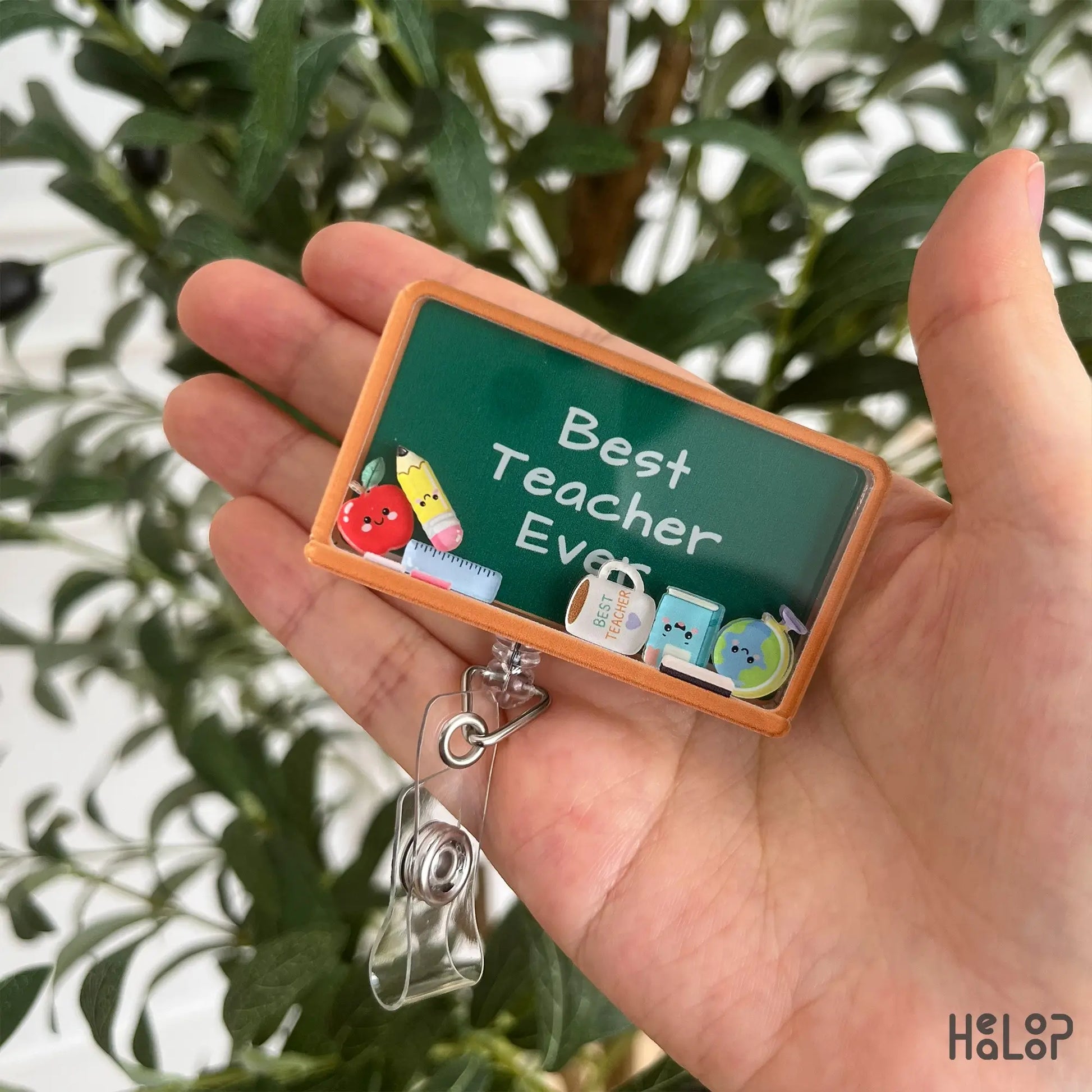 Front view of Best Teacher Ever shaker badge reel for teachers and educators