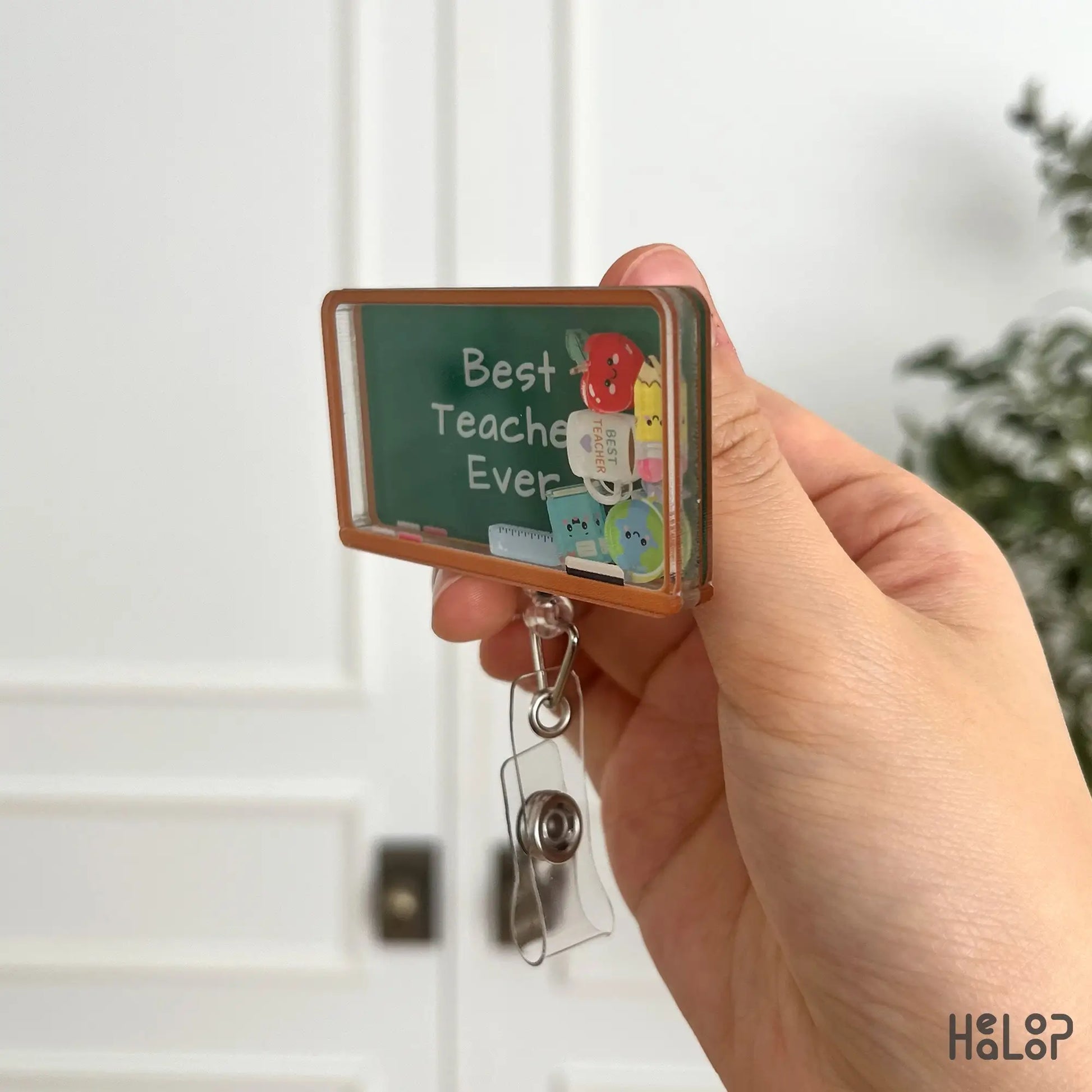 Profile view of teacher shaker badge reel with chalkboard acrylic design