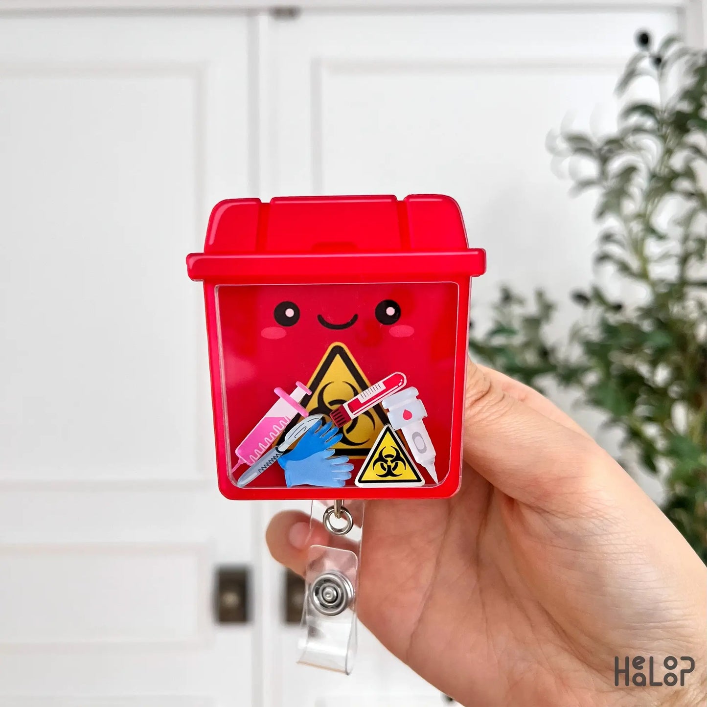 Biohazard sharps container shaker ID badge reel for medical professionals