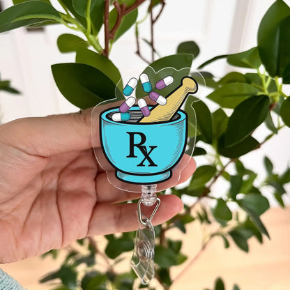 Blue RX Pharmacy Badge Reel with pills and mortar design – perfect for pharmacy technicians