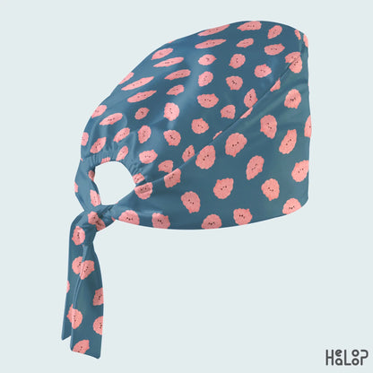 Brain Classic Scrub Cap angled view with cute pink brain print, teal-blue fabric, elastic back opening and adjustable fabric ties.