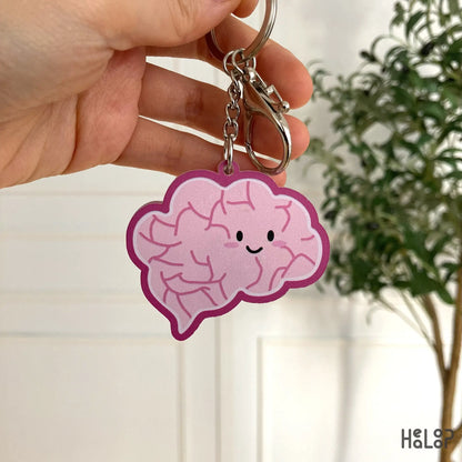 Backside illustration of adorable pink brain keychain.