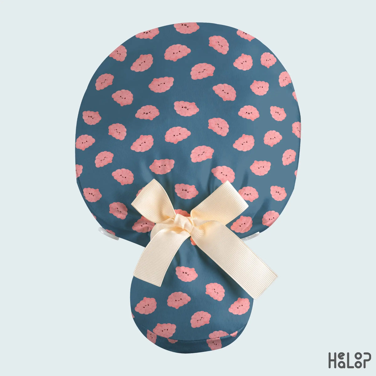 Brain Ponytail Scrub Cap back view featuring cute pink brain characters on teal-blue fabric, a spacious ponytail pouch, and a cream ribbon bow.
