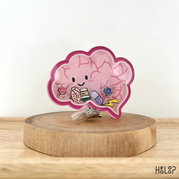 Side angle of shaker badge reel with mini brain and sparkle charms