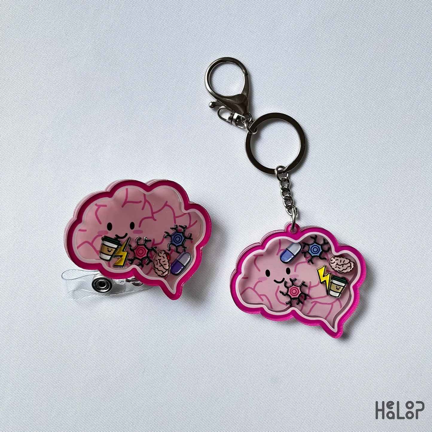Brain-shaped shaker keychain and matching badge reel with cute medical charms.