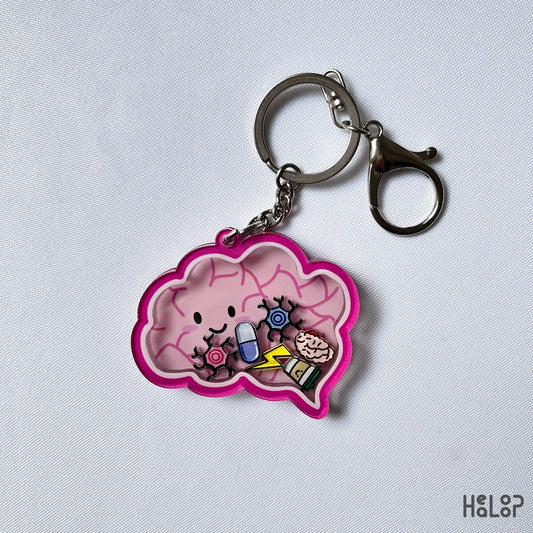 Brain shaker keychain displayed on white background with floating neuro-themed charms.