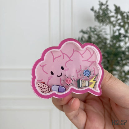 Cute anatomical brain shaker phone grip with floating charms, handheld