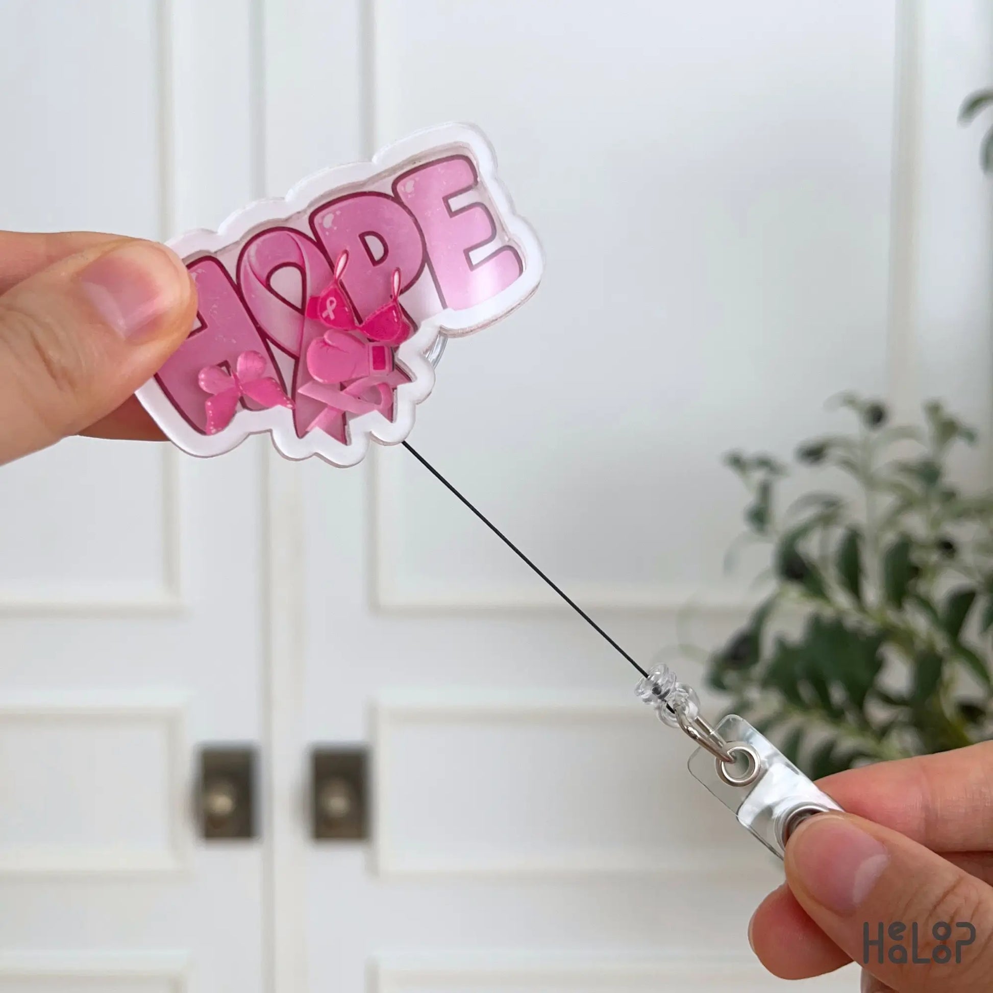 Retractable Breast Cancer Hope Shaker Badge Reel with pink ribbon and awareness-themed shaker charms.