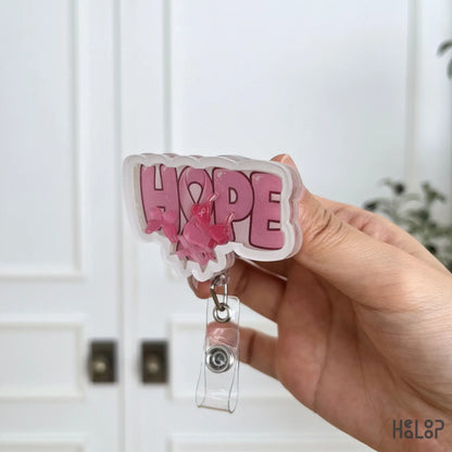 Side profile of Breast Cancer Hope Shaker Badge Reel showing durable layered acrylic design.