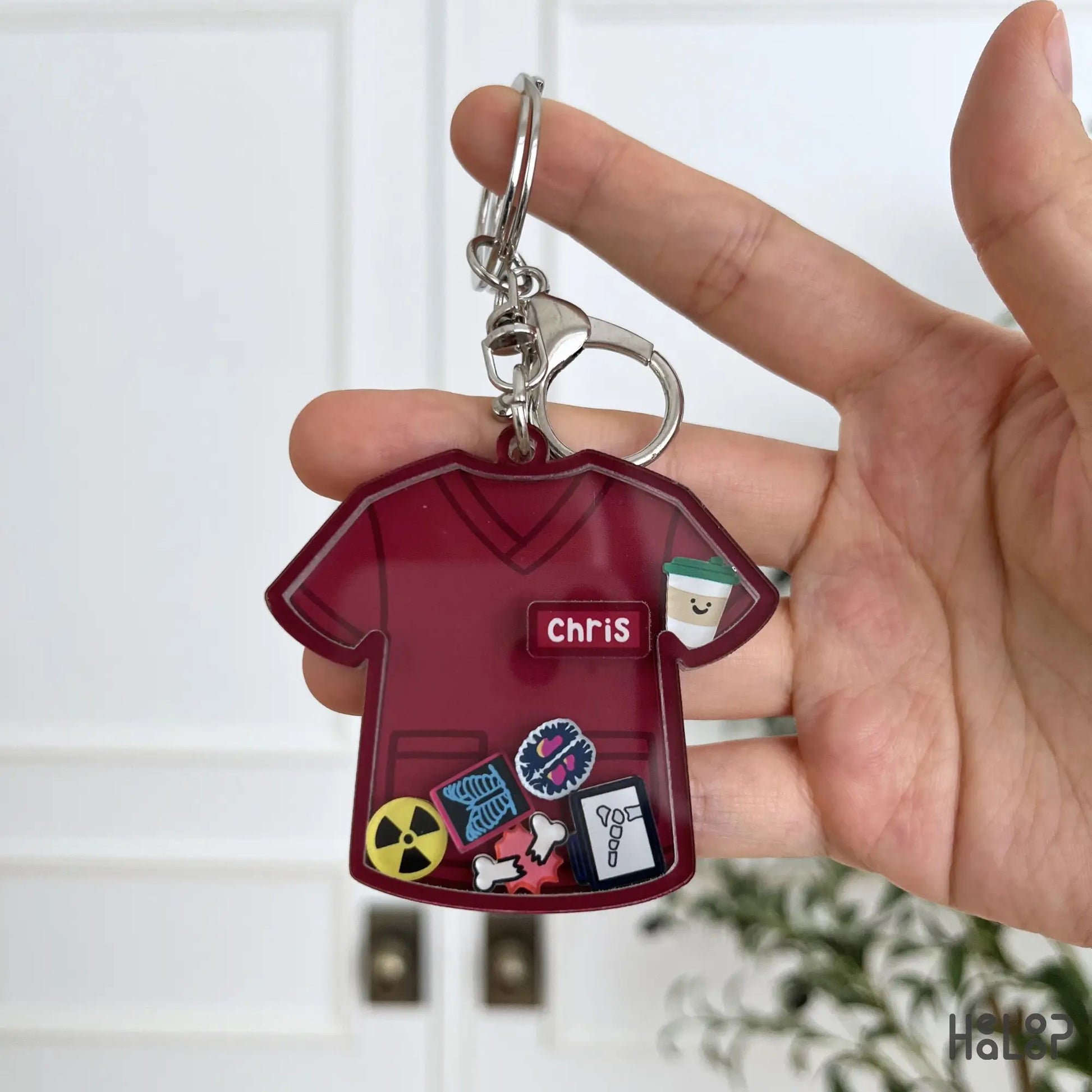 Burgundy custom nurse shaker keychain with personalized name and healthcare themed shaker charms.