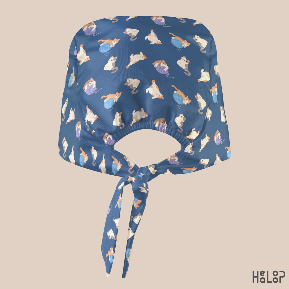 Cat Classic Scrub Cap shown from the back, featuring playful cats and colorful yarn balls on navy blue fabric with an elastic opening and adjustable tie-back closure.