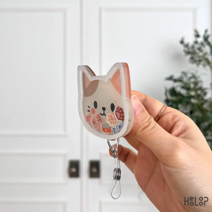 Acrylic cat shaker badge reel side profile showing layered shaker construction