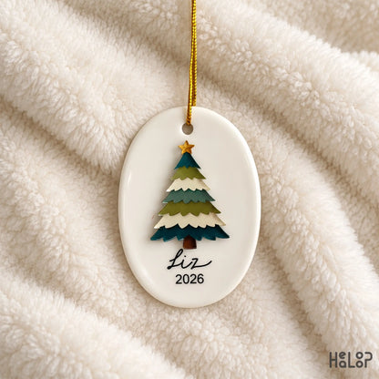 Ceramic Christmas ornament with raised layered acrylic tree personalized with the name Liz and year 2026