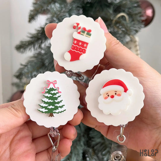 Christmas badge reels featuring Santa, Christmas tree and stocking designs