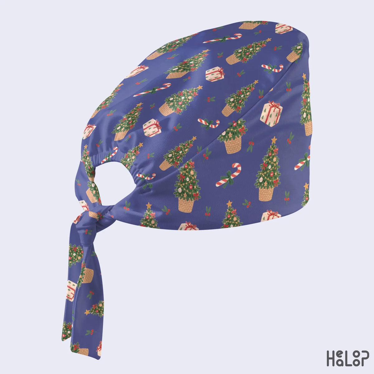 Christmas Classic Scrub Cap in blue featuring decorated Christmas trees, candy canes, wrapped gifts and holiday greenery, side view with fabric ties.