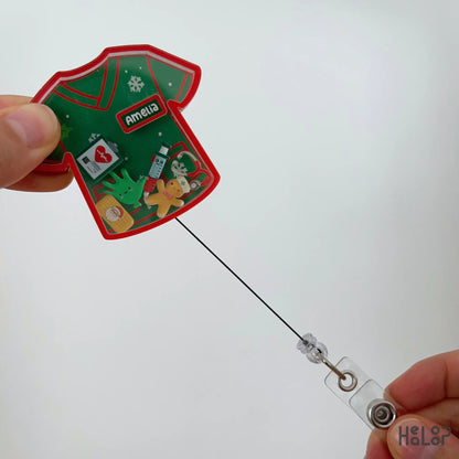 Custom Christmas nurse shaker badge reel with personalized name and retractable badge cord.