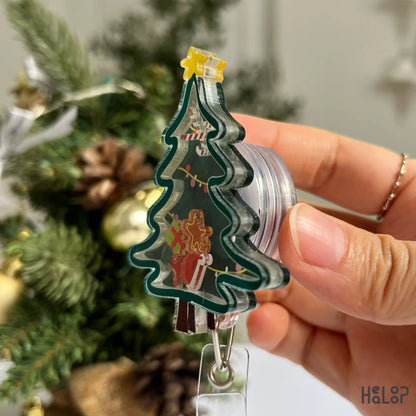 Funny and cute Christmas badge reel with gingerbread cookie, present, and stocking charms
