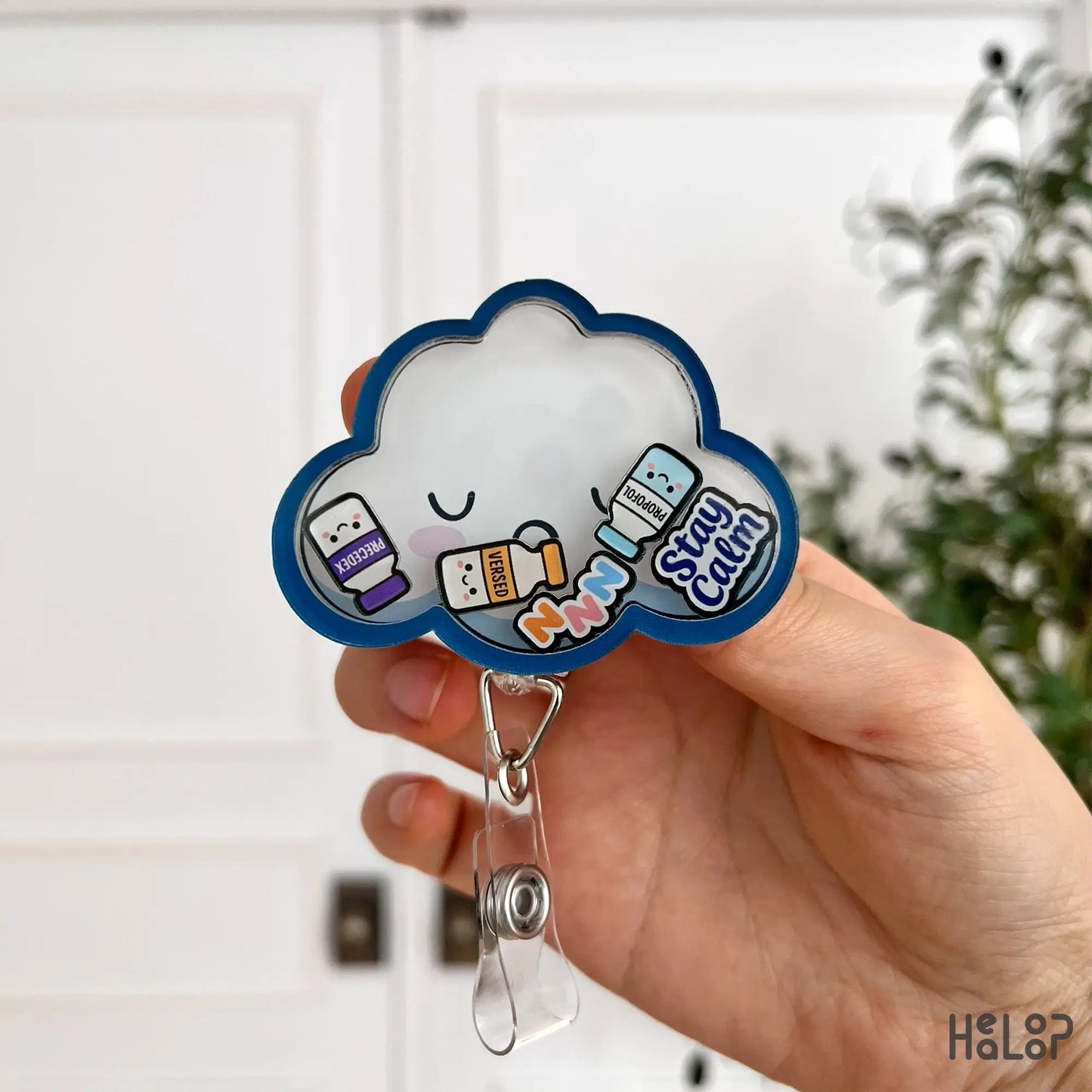 Front view cloud anesthesia shaker badge reel with propofol, versed and precedex charms