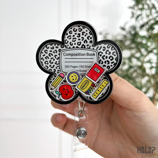 composition book badge reel with pencils, crayons, ruler, and apple charms for teachers