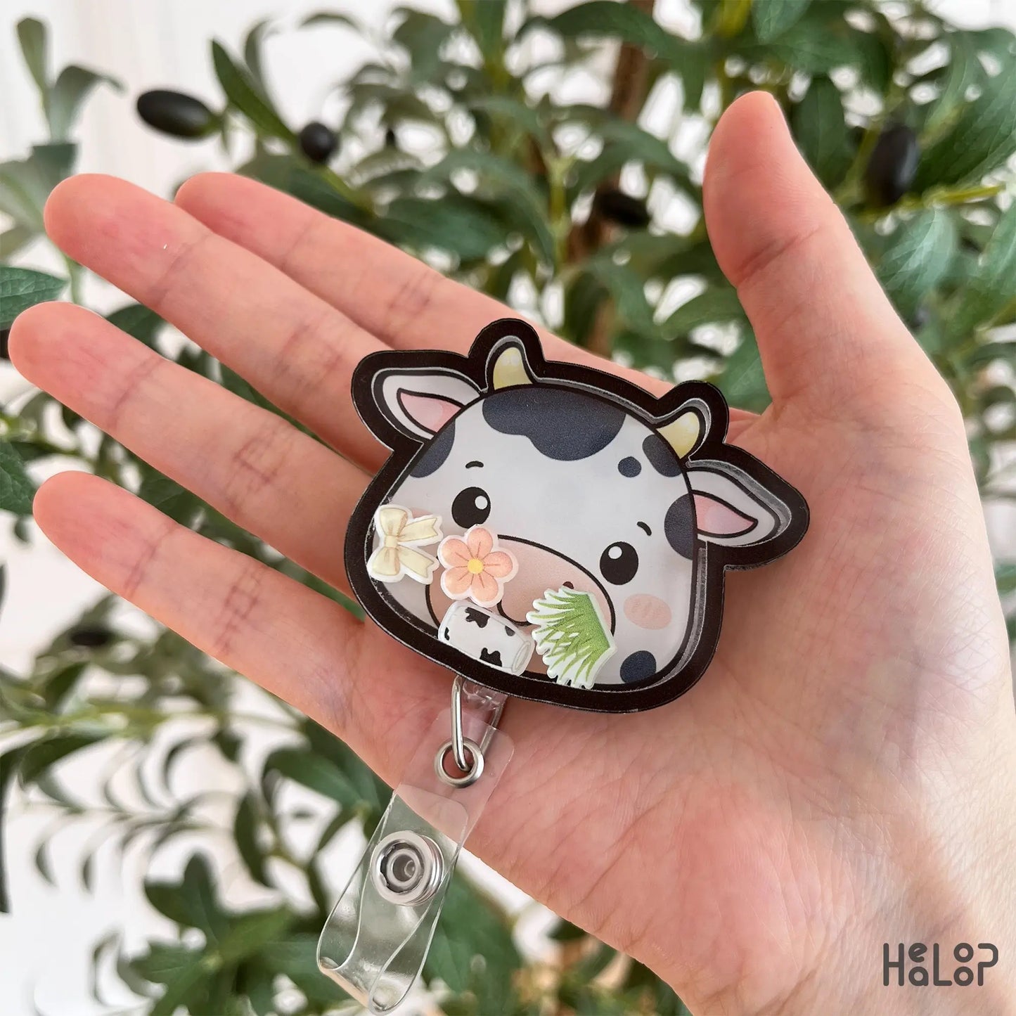 cow shaker badge reel held in hand cute nurse accessory animal themed id holder