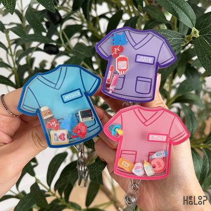 Custom nurse shaker badge reel available in three scrub top colors with name personalization