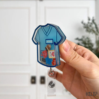 Side profile of custom nurse shaker badge reel showing thickness and acrylic layers