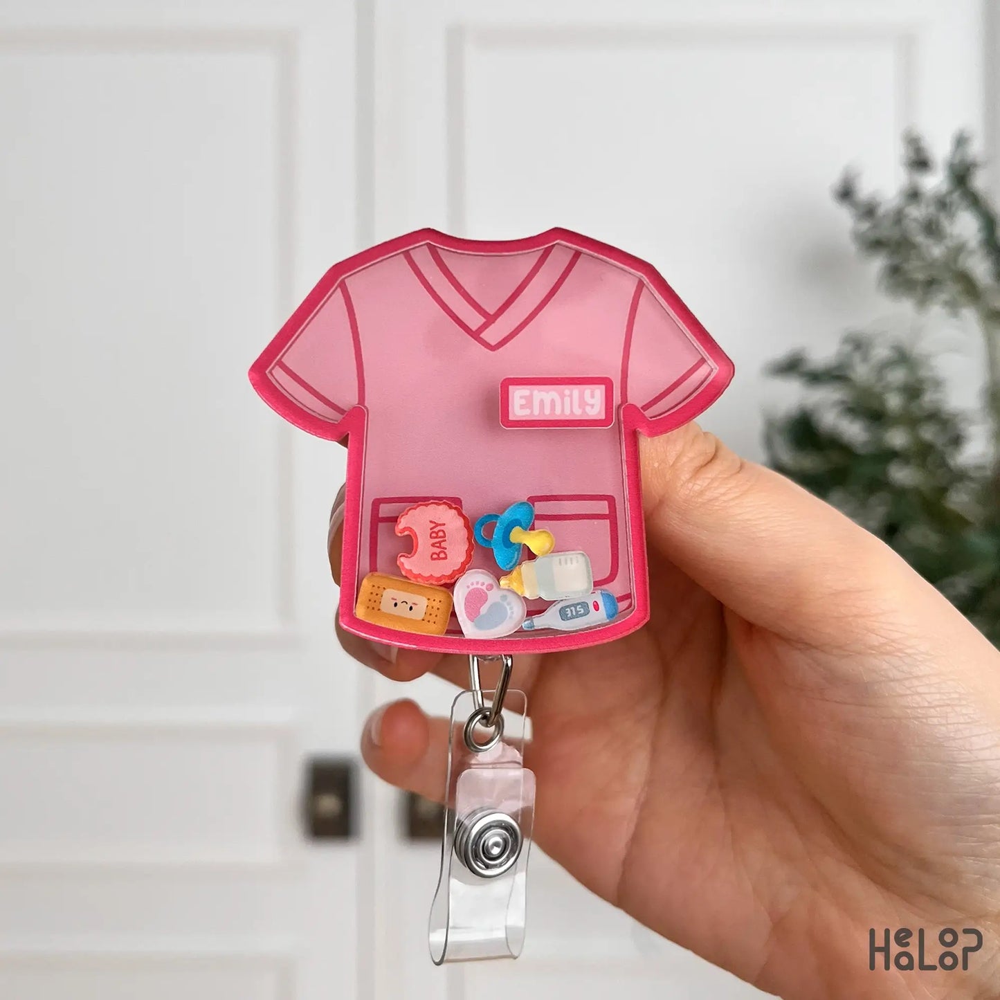Pink custom nurse badge reel with baby themed charms and personalized name option